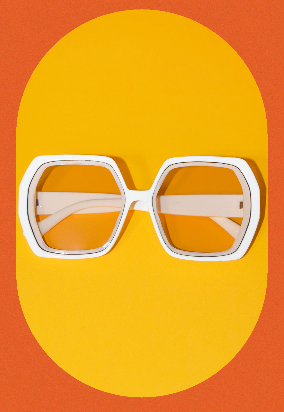 orange and yellow background and squared ivory translucent ivory sunglasses